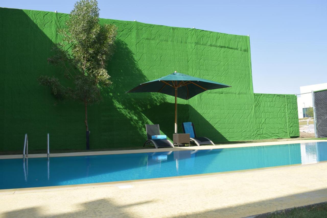 Retaj Salwa Resort & Spa Doha Buitenkant foto A swimming pool in Spain