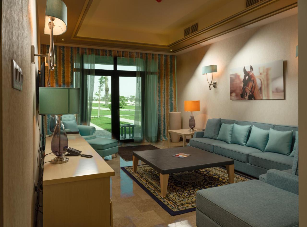 Retaj Salwa Resort & Spa Doha Buitenkant foto A living room in a suite at the Ritz-Carlton, Dubai